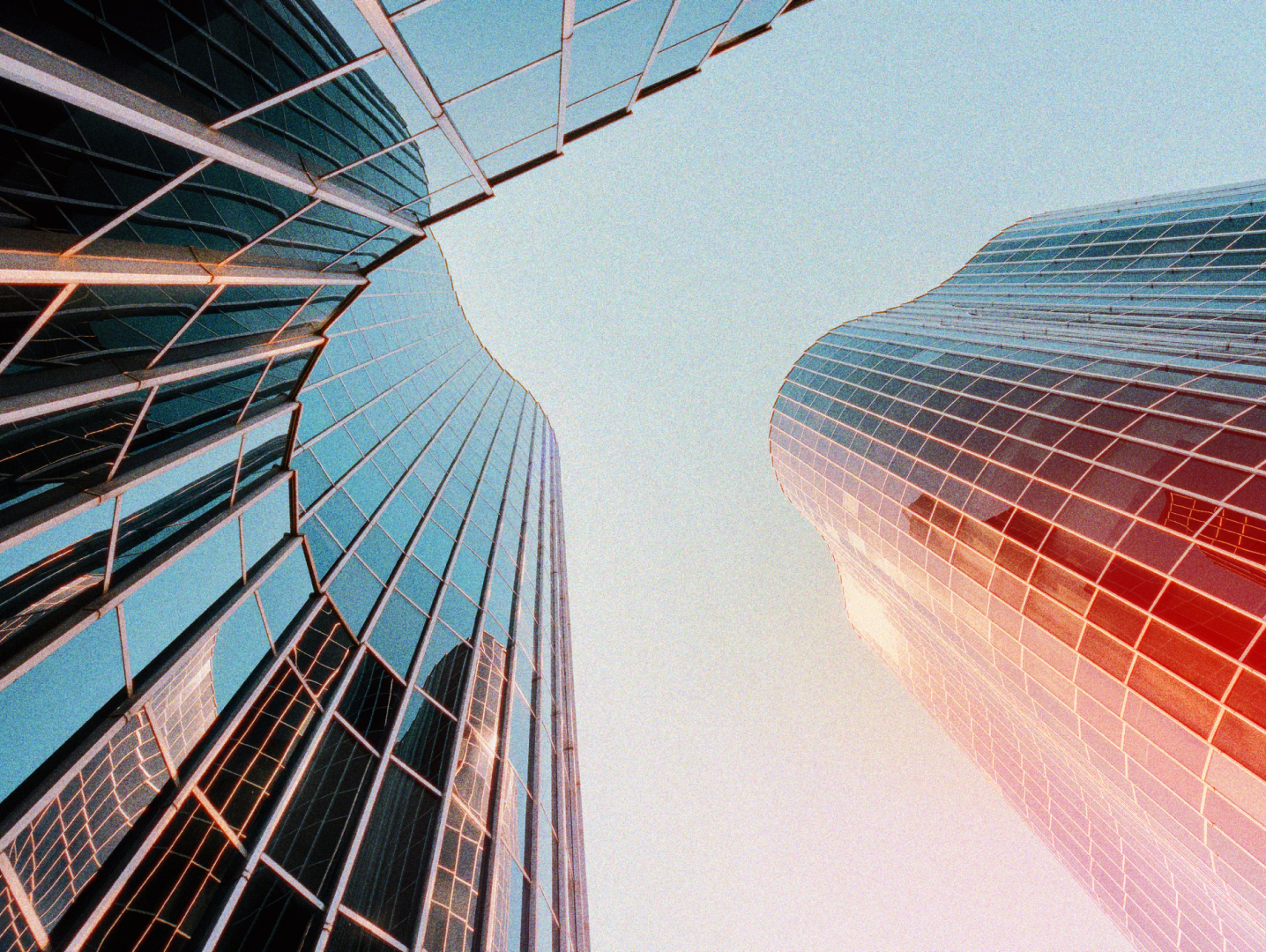 Skyscrapers viewed from below representing scaling repeat hires