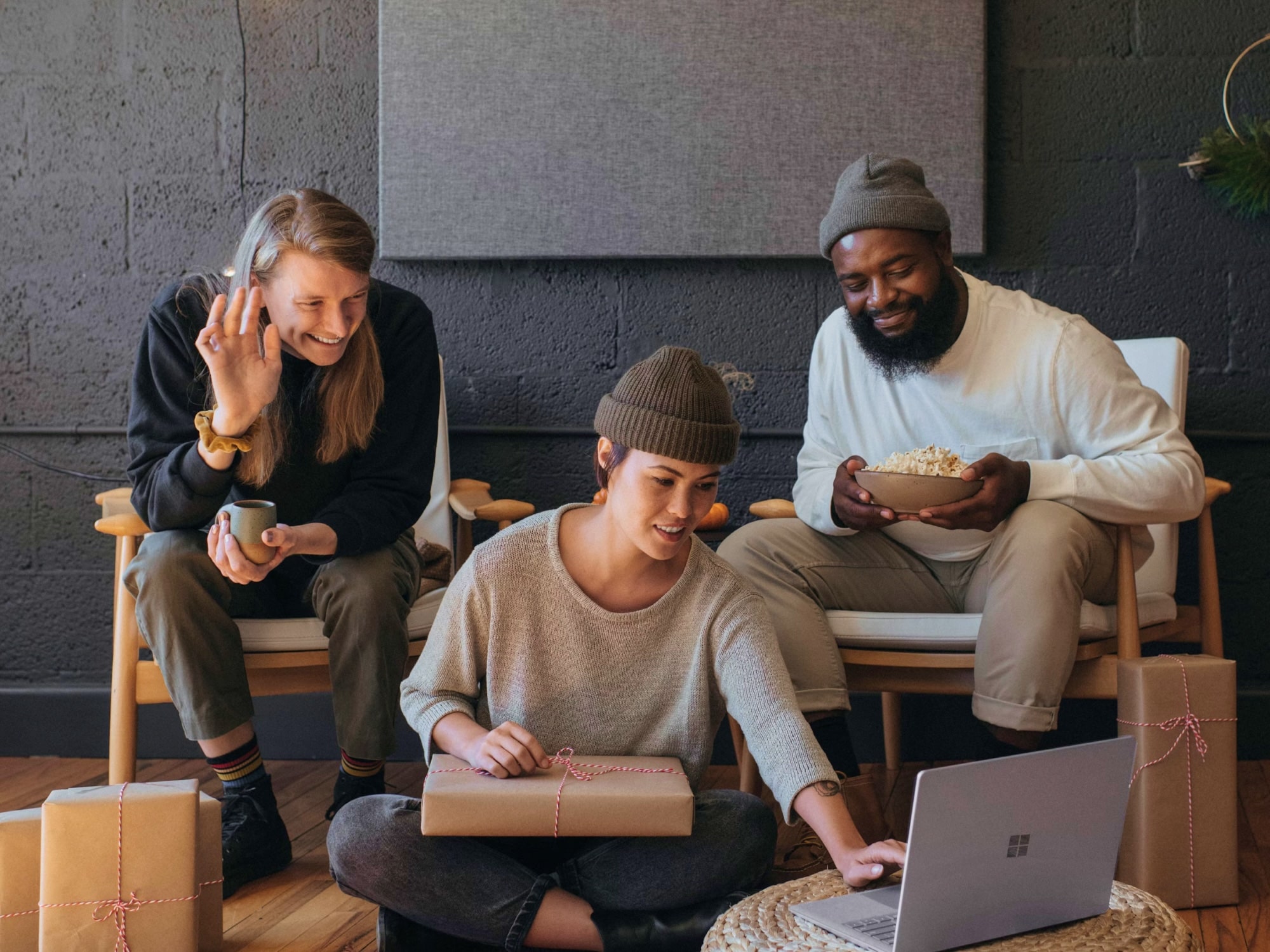 Team collaborating around a laptop