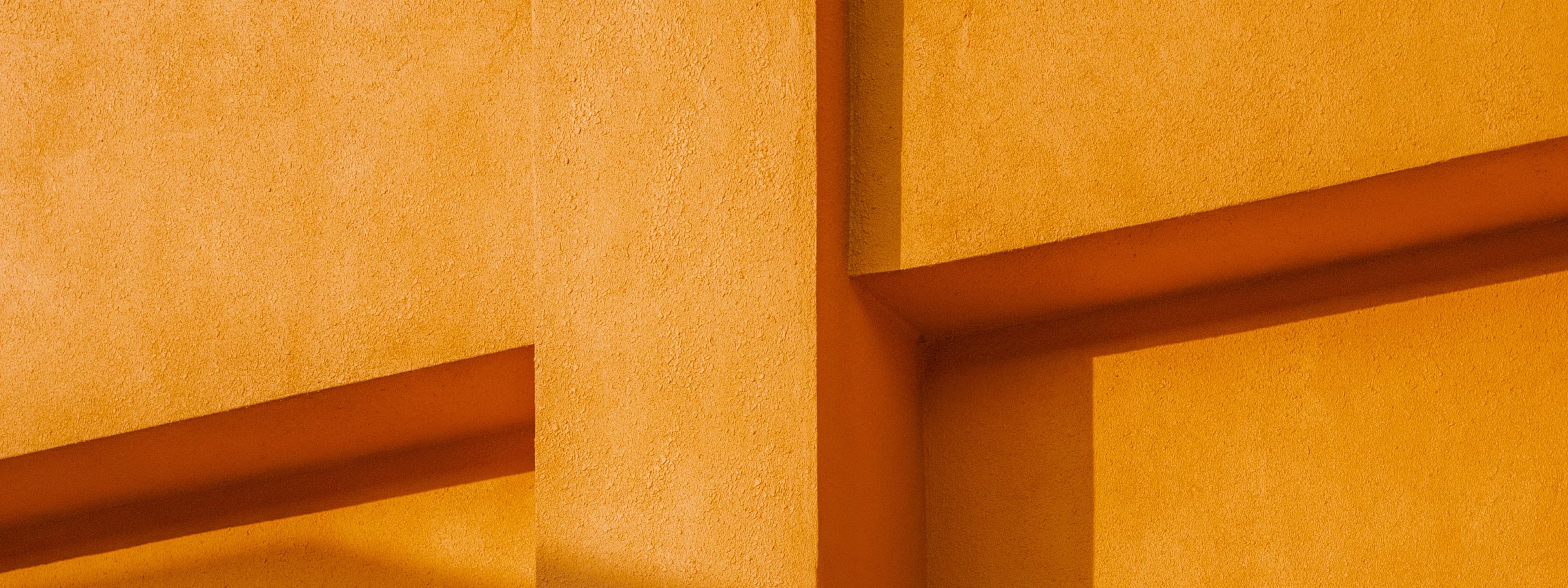 Warm architectural walls with strong shadows